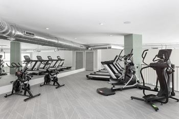 Two story fitness center with high endurance equipment free weights resistance & spin bikes